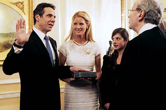 Andrew Cuomo is sworn in as NY's 56th governor with girlfriend Sandra Lee at his side